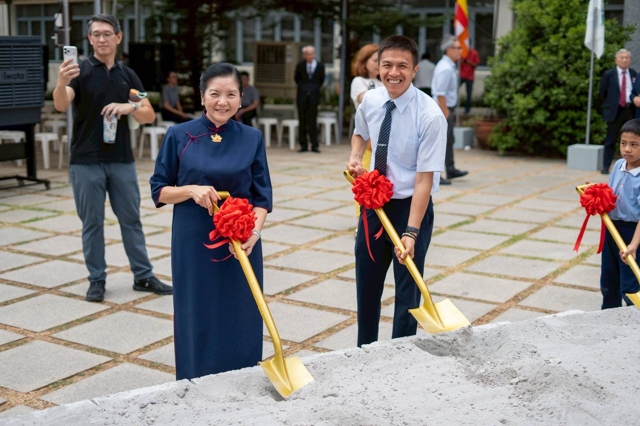 Everybody was invited to participate in symbolic shoveling at the groundbreaking site.