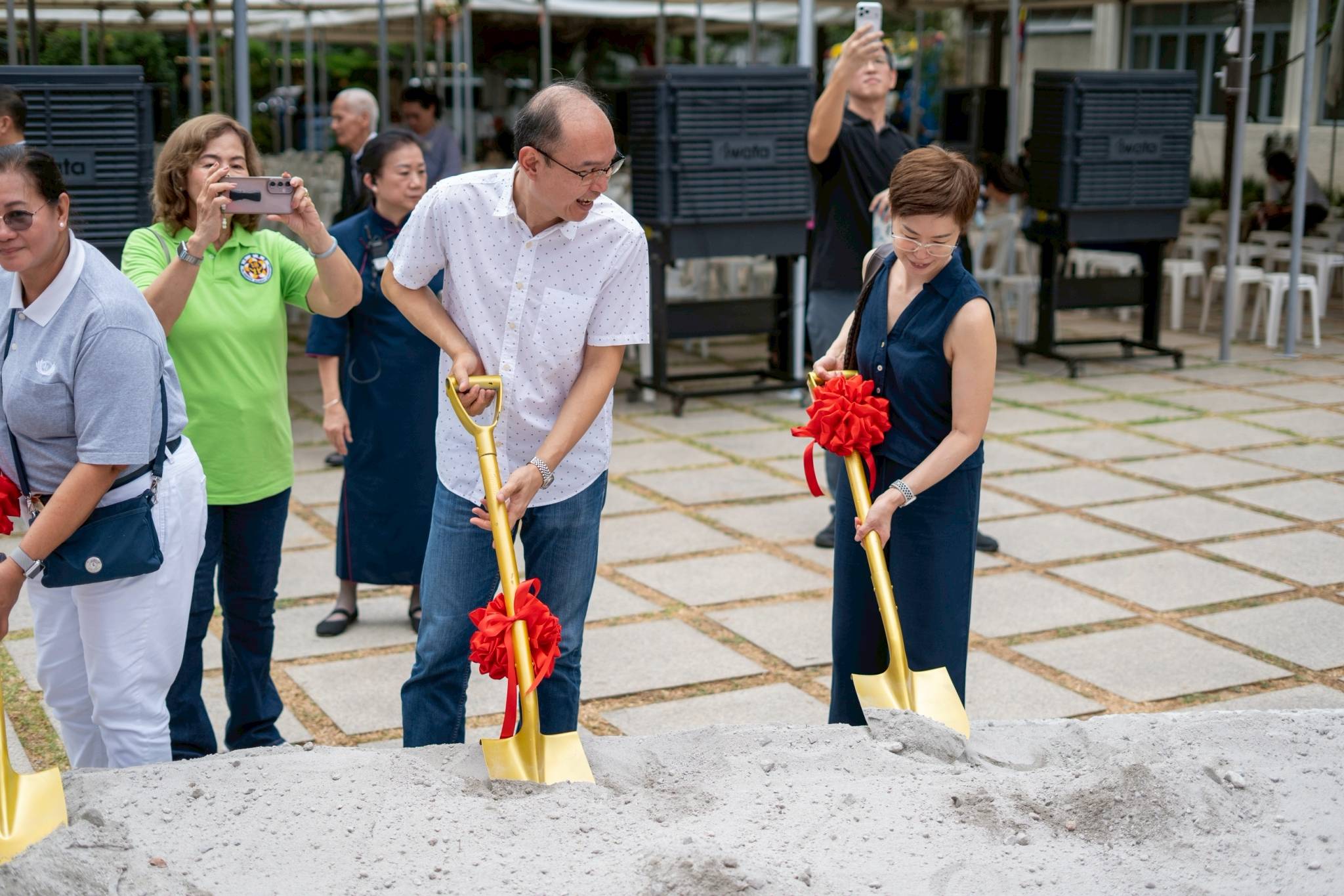 Everybody was invited to participate in symbolic shoveling at the groundbreaking site.
