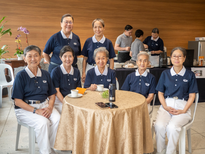 Volunteers savor free coffee, fellowship, and celebration at Unity Hall after their festive breakfast.