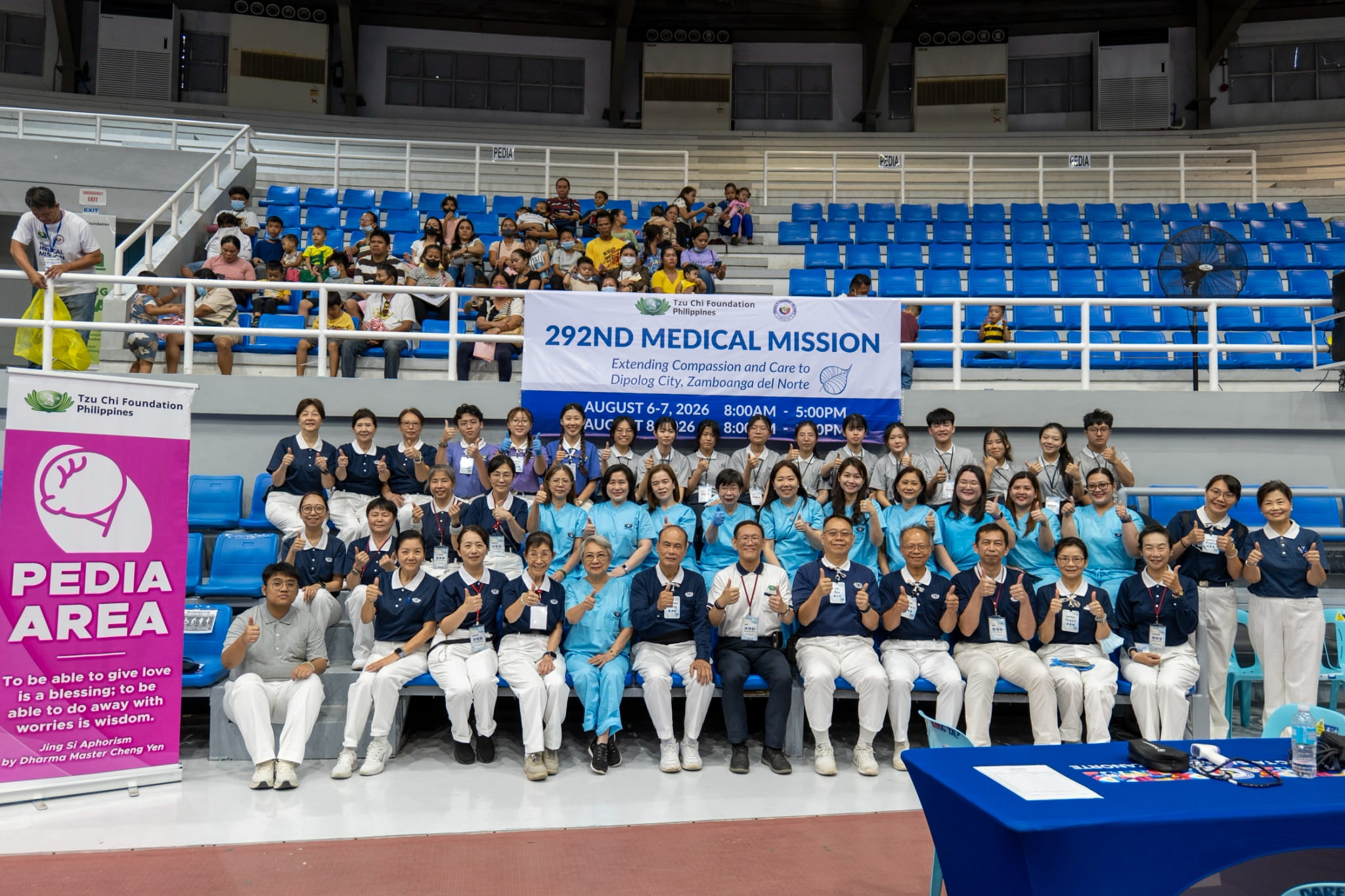 Pediatric doctors join Tzu Chi Youth, volunteers, and students from Tzu Chi University in Taiwan for a group photo, united in their spirit of service.