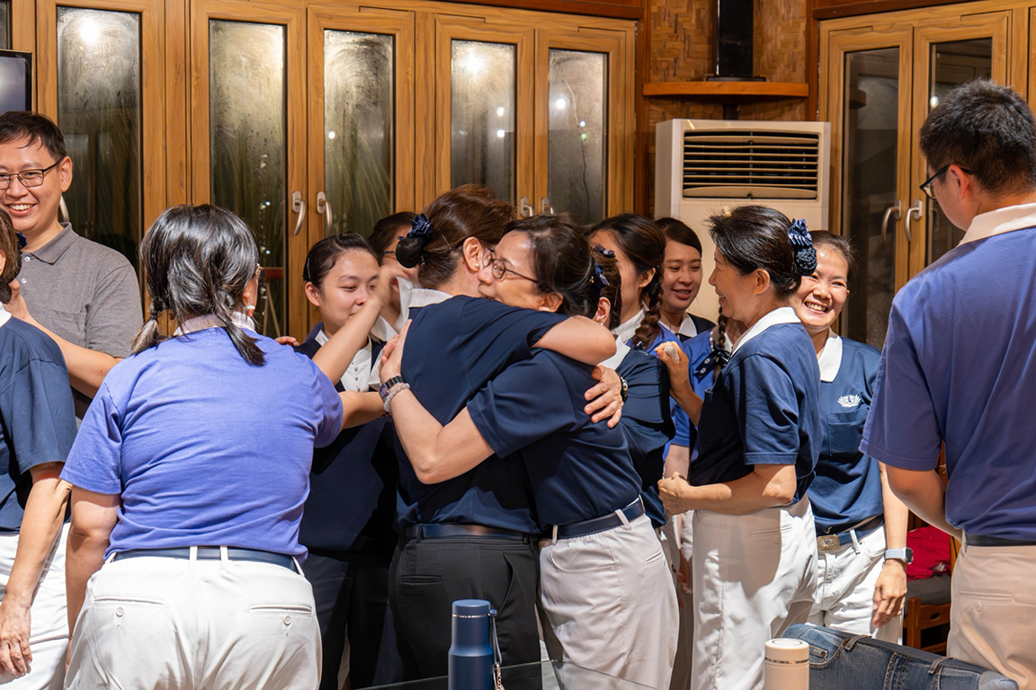 In an emotional farewell , volunteers and youth exchange hugs and tears of joy.