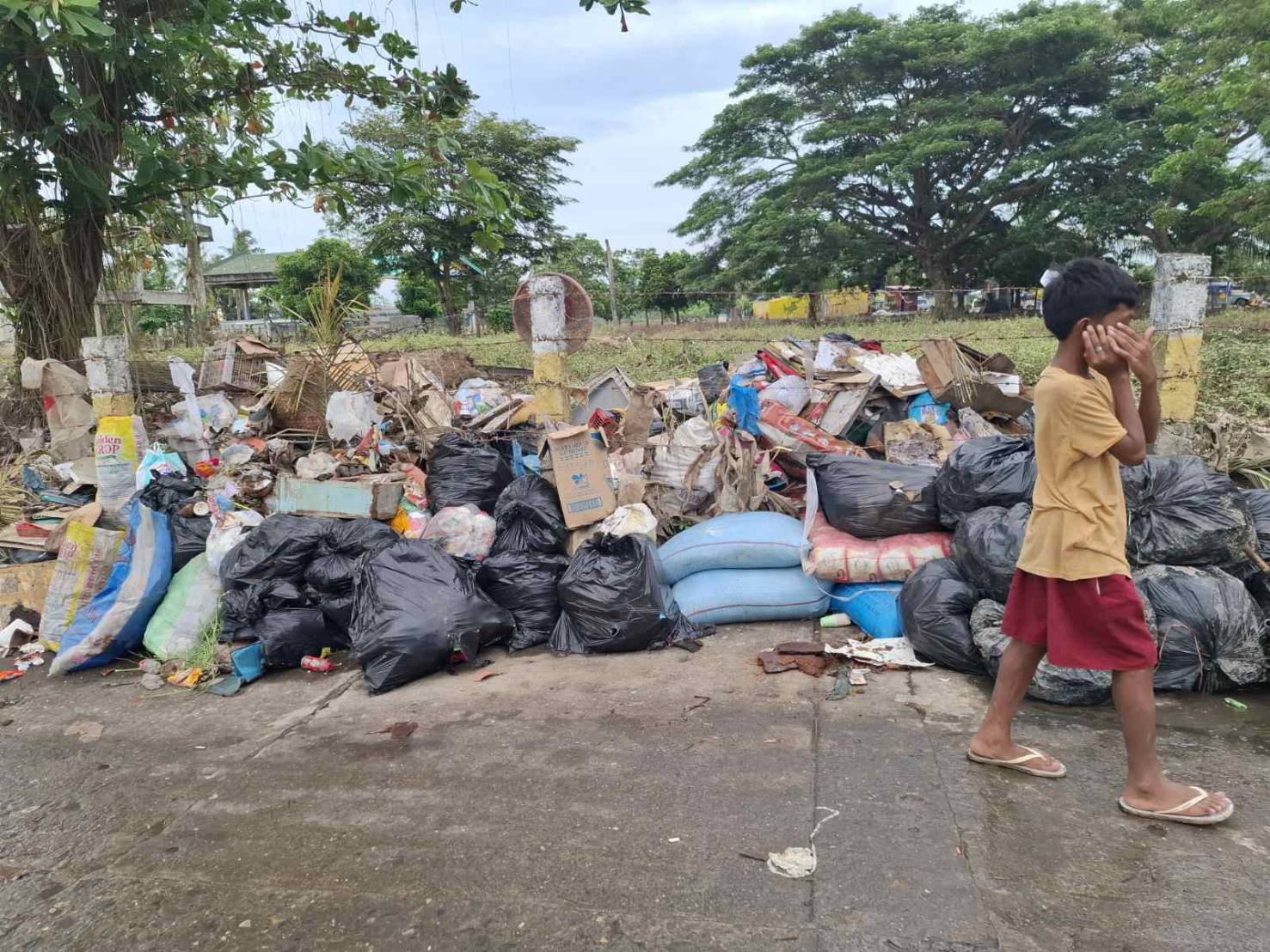 Uncollected garbage is lined along the roads of towns in Sabang, Naga City.