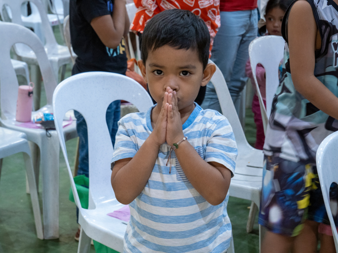 A child prays during the medical mission.