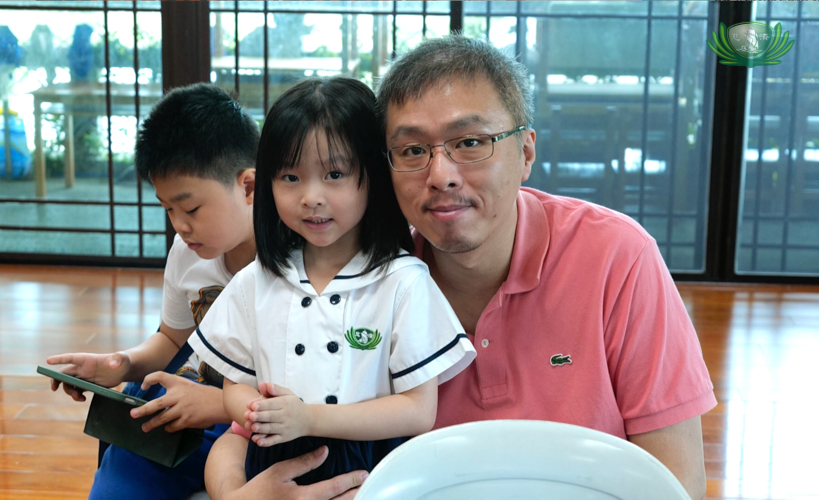 A father poses for a photo with his daughter during the Filial Piety celebration at Tzu Chi Great Love Preschool Philippines.
