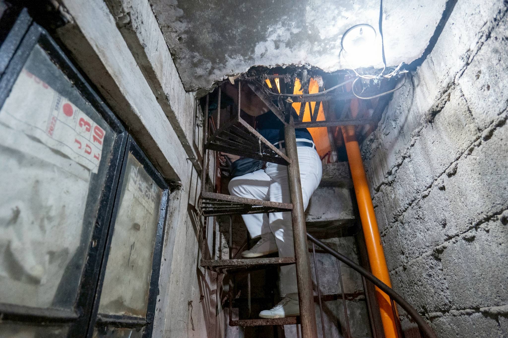 Their home in Bagong Barrio, Caloocan, is a compact space accessible by a narrow, winding staircase to the second floor.