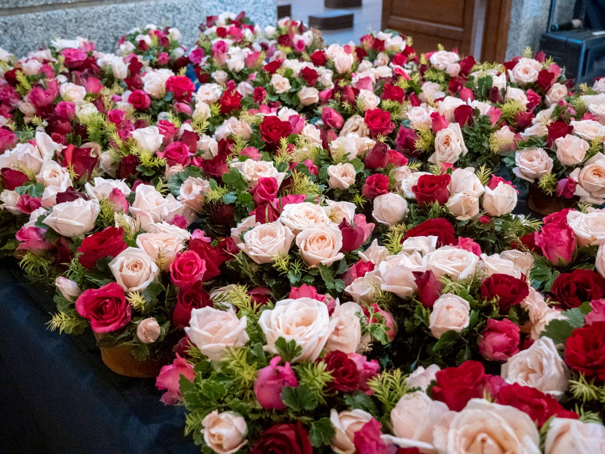 Fresh flowers are arranged in preparation for the ceremony. 
