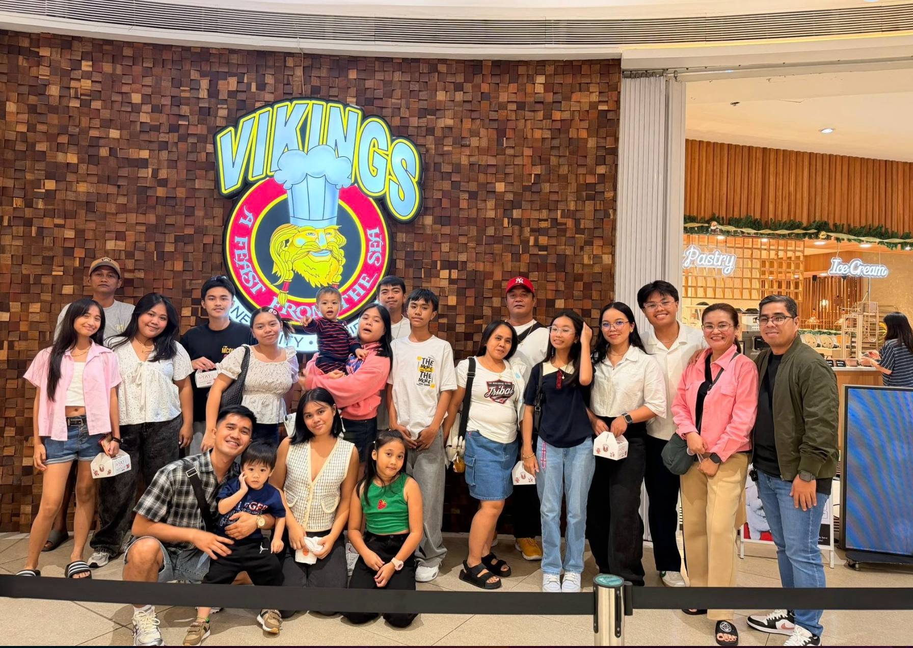 Jaycee Cabiao (front row, first from left) joins his family in celebrating the birthdays of his mother (in denim skirt) and father (in red cap). / Source: Jaycee P. Cabiao 