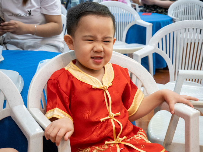 Preschoolers show up sporting their best Chinese attire. 