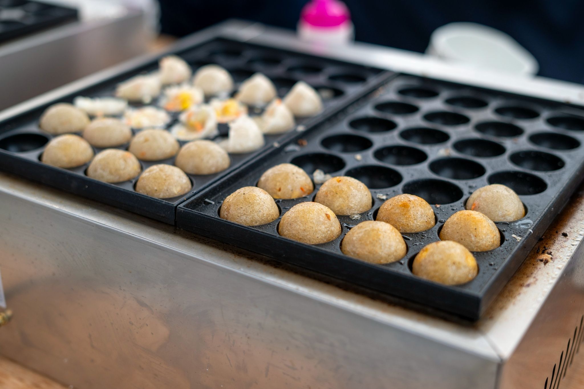 Tzu Chi Youth create their own flavorful version of vegan takoyaki with carrots, cabbage, and corn seasoned with vegan seasoning.