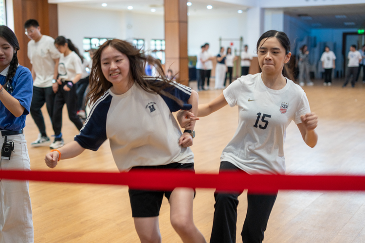 Participants freeze in position during the “Red Light, Green Light” game.