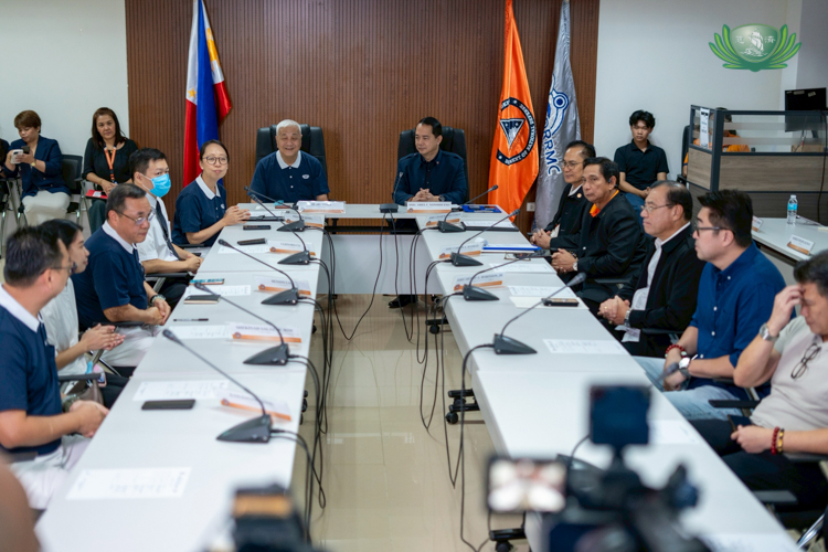 Representatives from the Office of Civil Defense and Tzu Chi Philippines gather to formalize the agreement for disaster preparedness and response.
