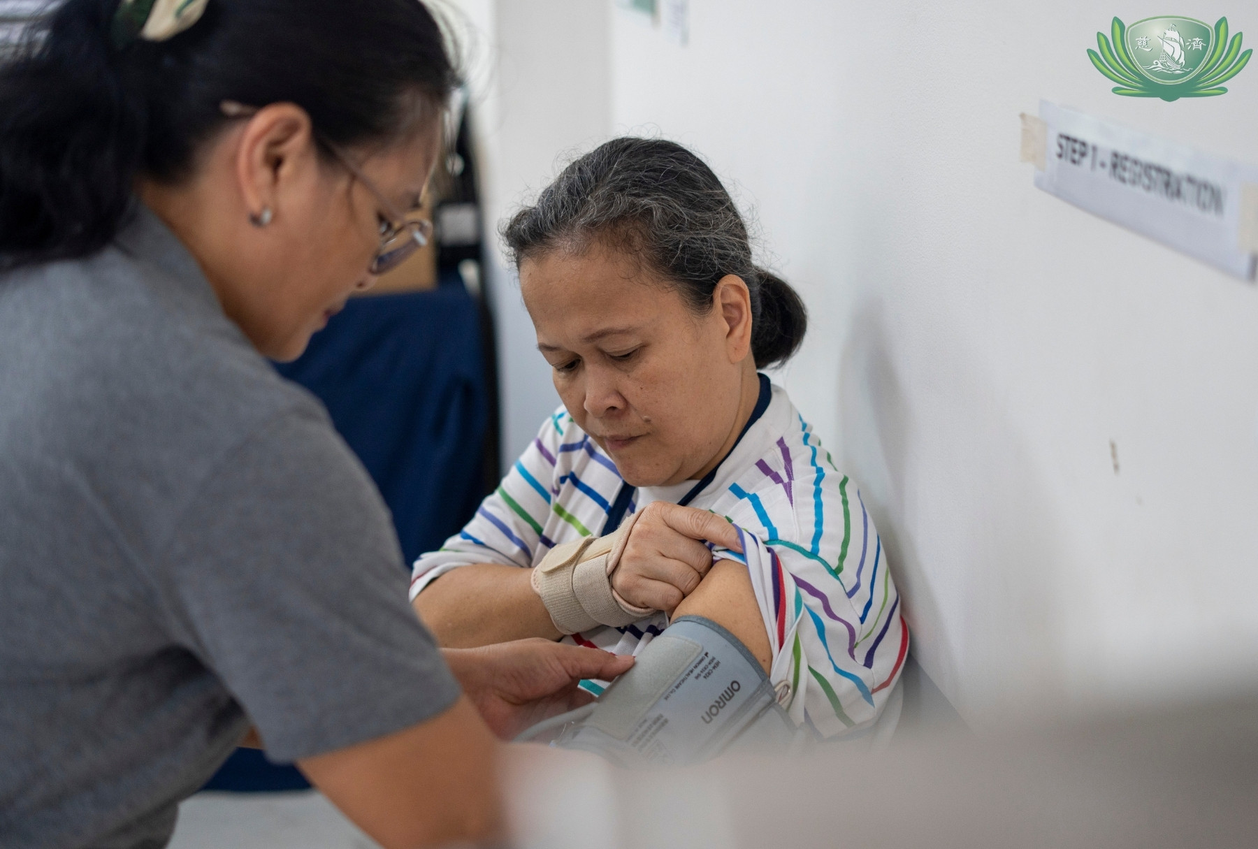 Maribeth Menge gets her vital signs taken before undergoing acupuncture.