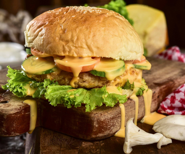 Handcrafted from oyster mushroom, Kabutihan Farm’s plant-based mushroom burger is served with slices of fresh tomatoes, cucumber, and fresh lettuce and oozing in melted cheese. 