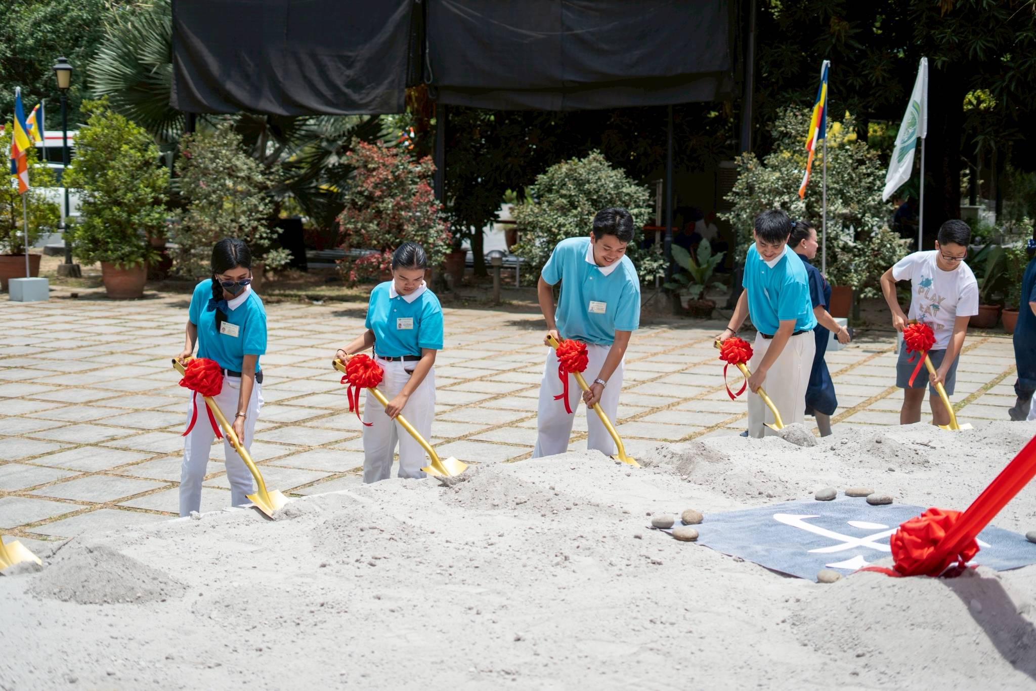Everybody was invited to participate in symbolic shoveling at the groundbreaking site.