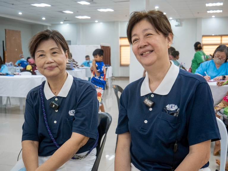 Tzu Chi volunteers Molita Chua (left) and Josephine So commended the dedication of the TIMA doctors, noting their commitment to waking up early for Day 1 despite long travel hours and a late-night arrival.