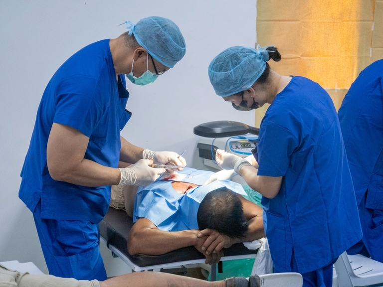 Minor surgery was among the services offered, with surgeons working efficiently to attend to patients who had long endured pain and discomfort.