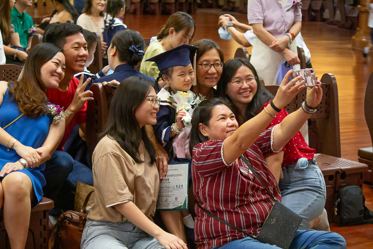 No moving up ceremony is complete without selfies and photos with the preschoolers.