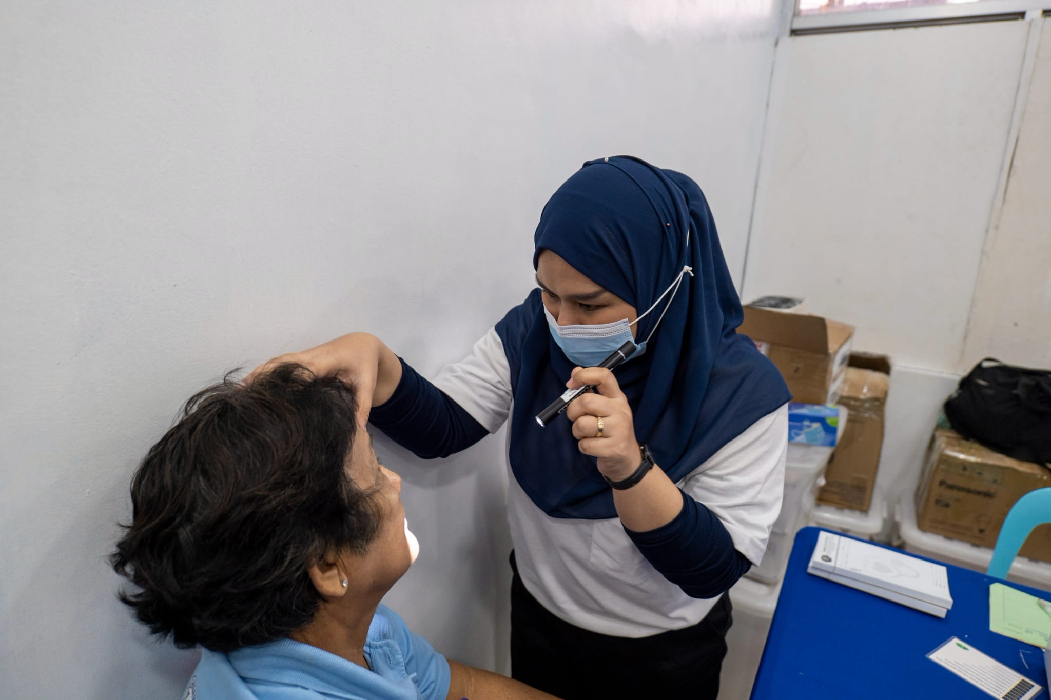 The ophthalmology team conducts eye screenings and check-ups, providing free reading glasses to patients in need.
