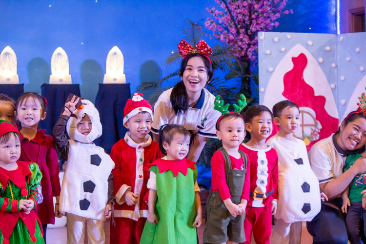 Nursery Teaching Assistant Marian “Yani” Carpo (center, in red headband) is always happy to guide her students.