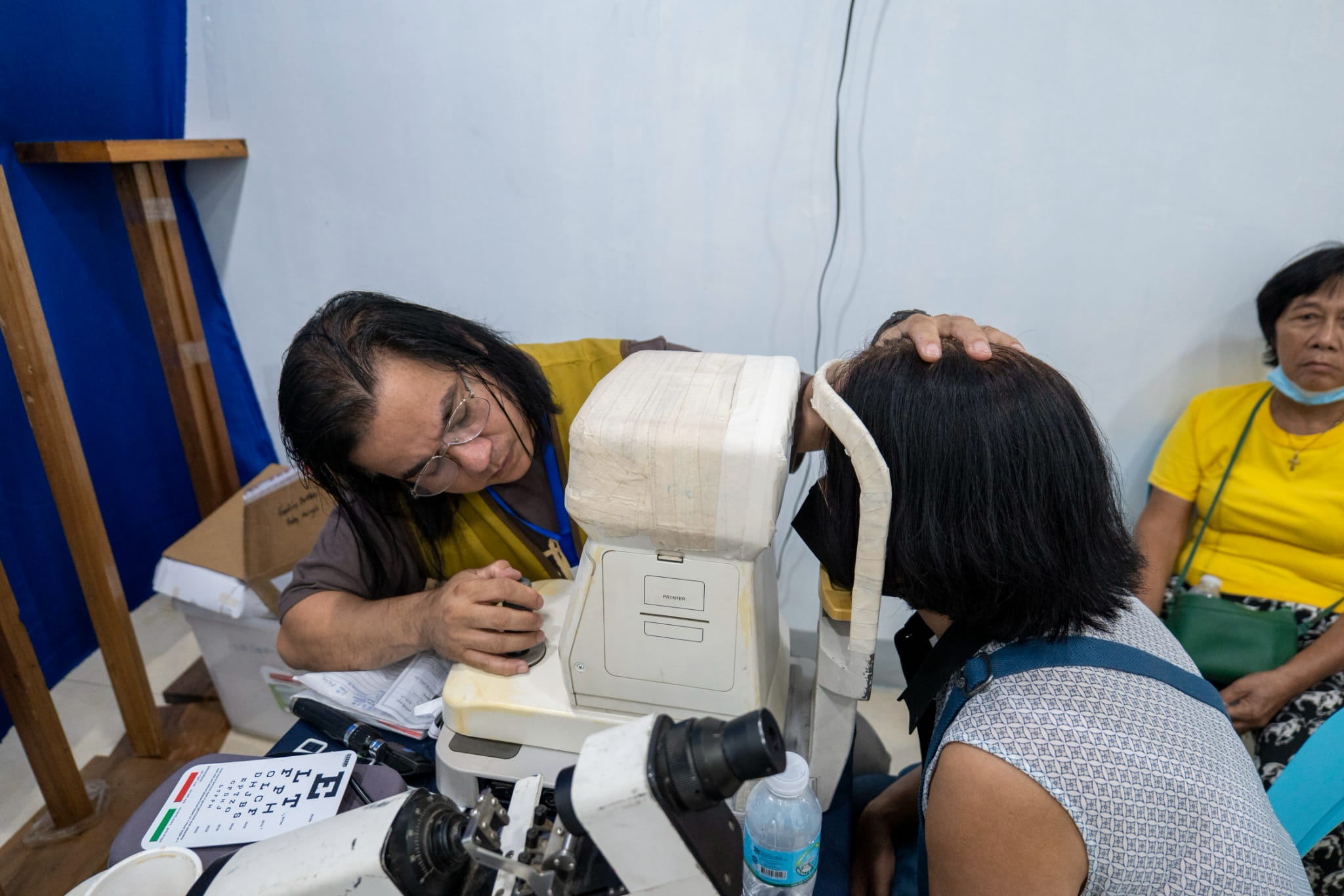 The ophthalmology team conducts eye screenings and check-ups, providing free reading glasses to patients in need.