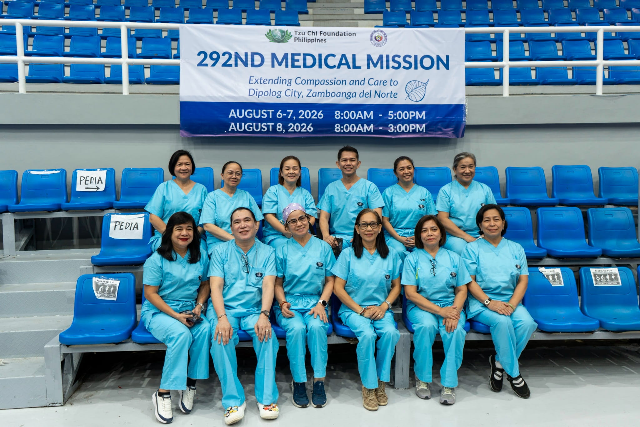 The dental team takes a group photo after completing a busy day of treating patients. 