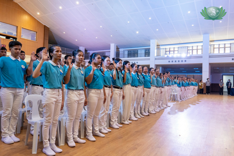 After a ceremonial graduation ceremony, scholars recite the Alumni Pledge.