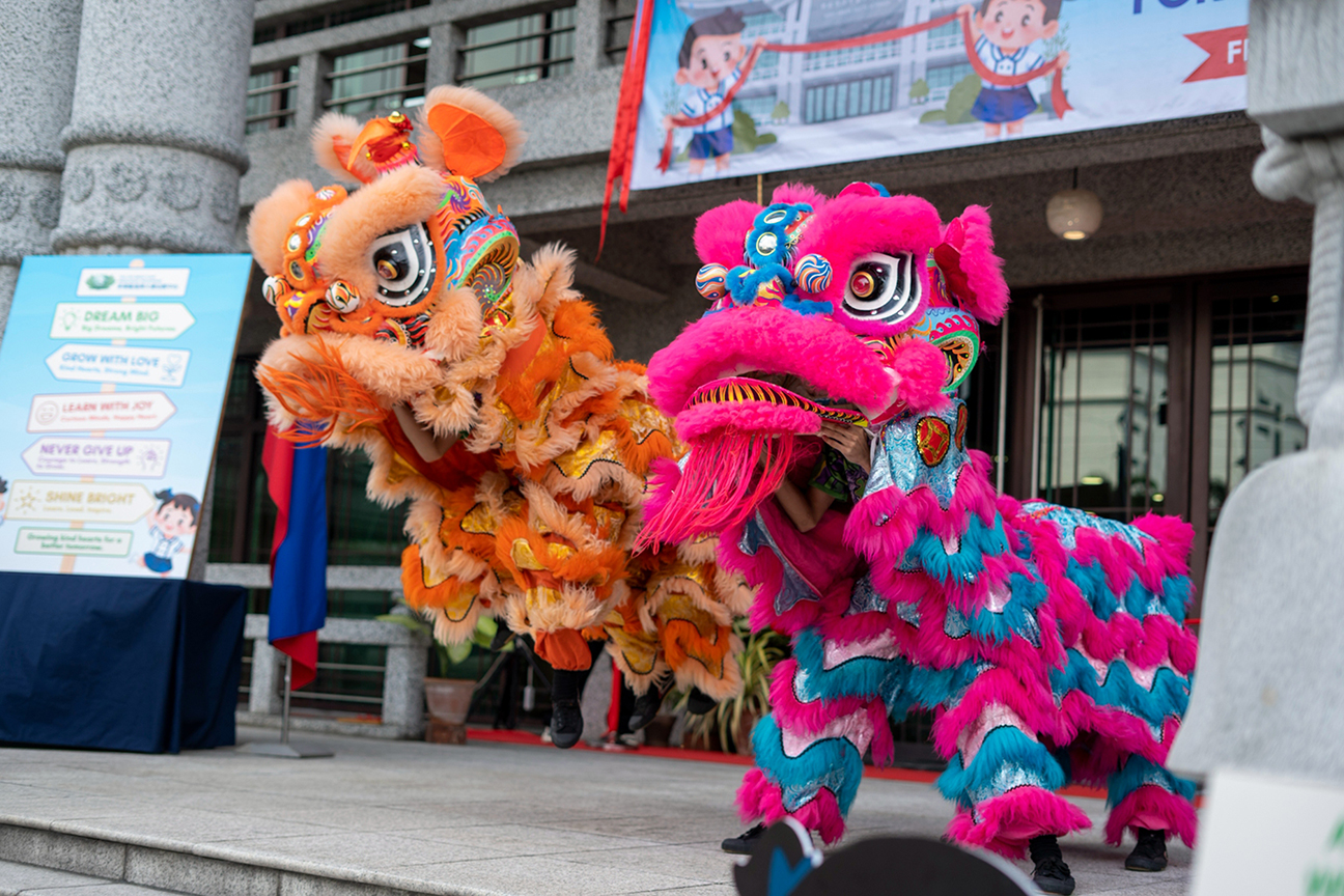 Marking a vibrant new beginning, a Chinese lion dance performance celebrates the opening of Tzu Chi kindergarten.