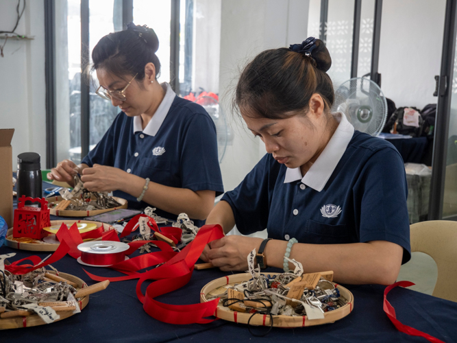 Tzu Chi volunteers worked hard in preparing the tokens for the house recipients days before the turnover ceremony.