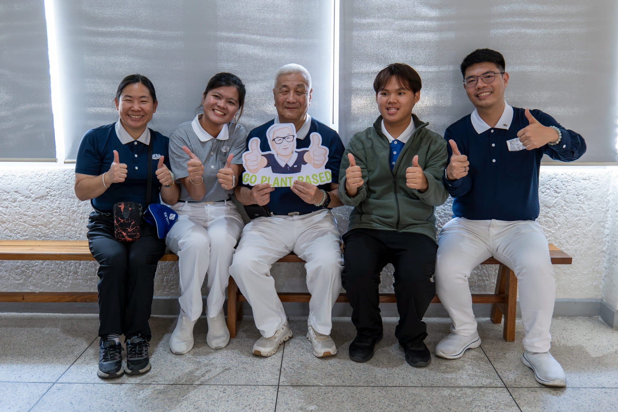 Tzu Chi Philippines CEO Henry Yuñez (center) shares a light moment with Tzu Chi volunteers and staff.