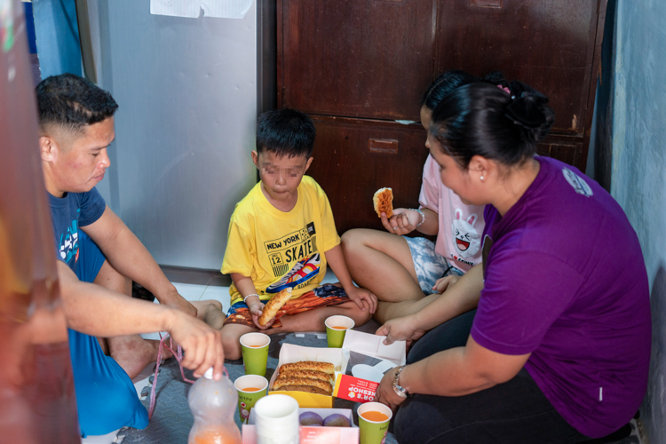 A tiny dining area  is not a hindrance for the Amilano family to enjoy eating their snacks together as a form of quality time.