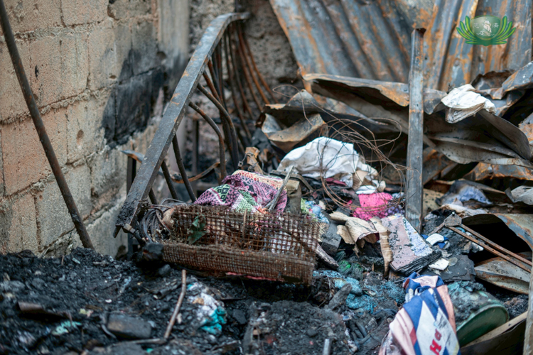 Random items were scattered about as residents began to clear their homes and streets of ash and debris following the fire.