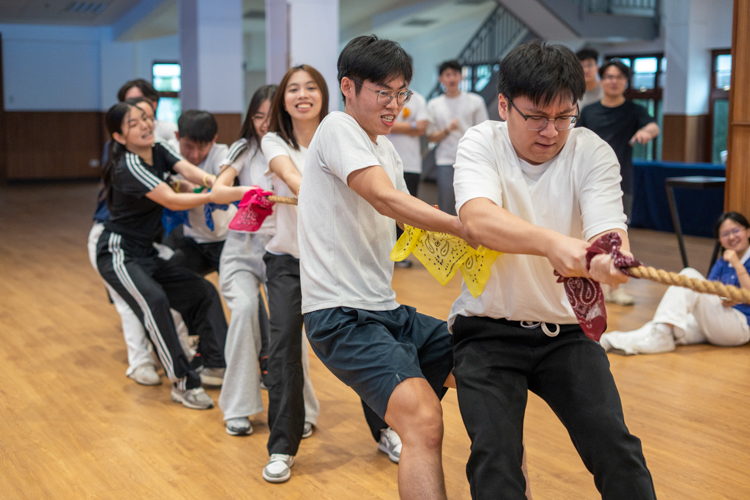 Teams put their collective strength to the test during an intense tug-of-war match.