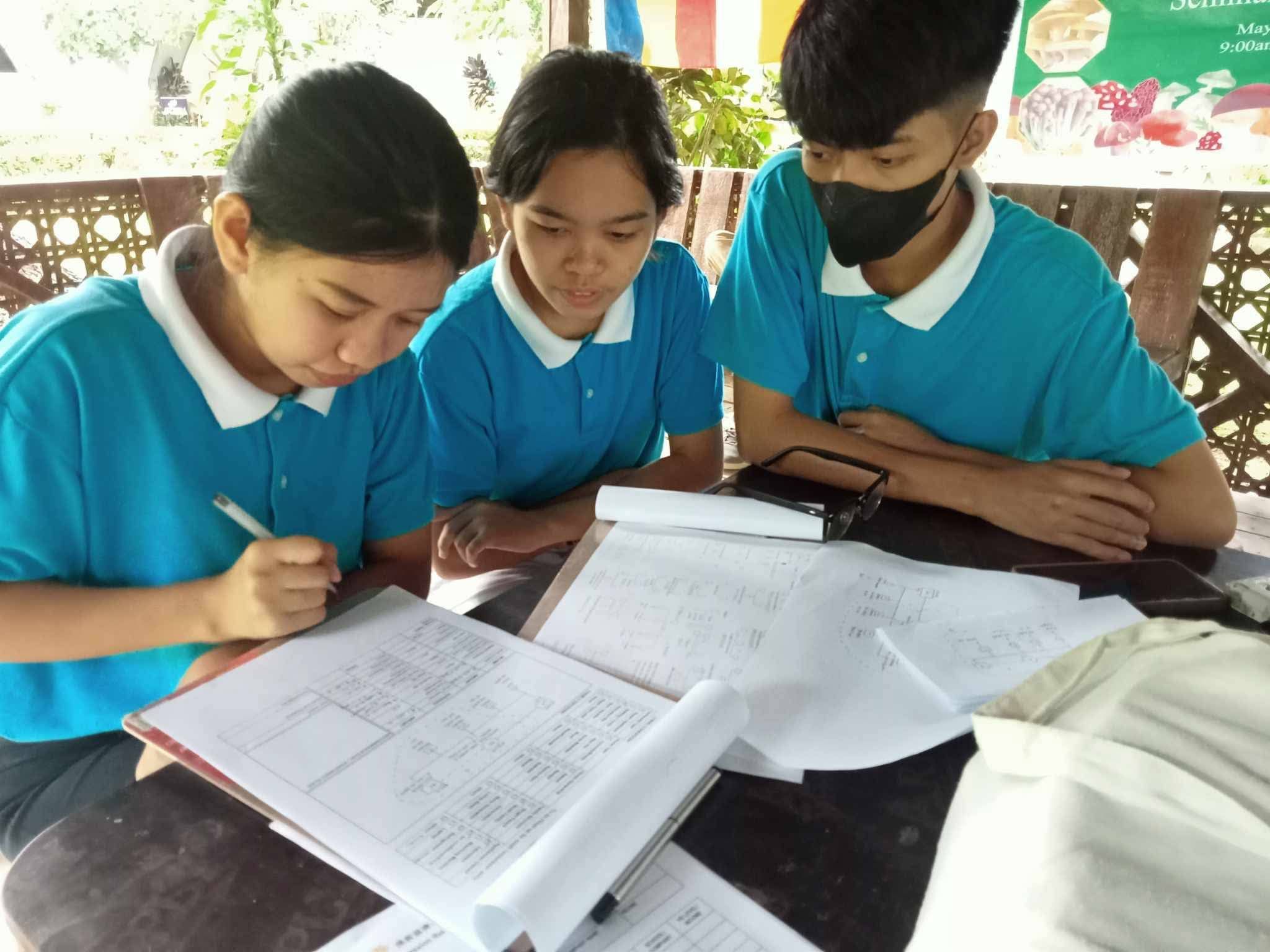 Shekinah Salazar (first from left) helps in home visitations with fellow scholars.