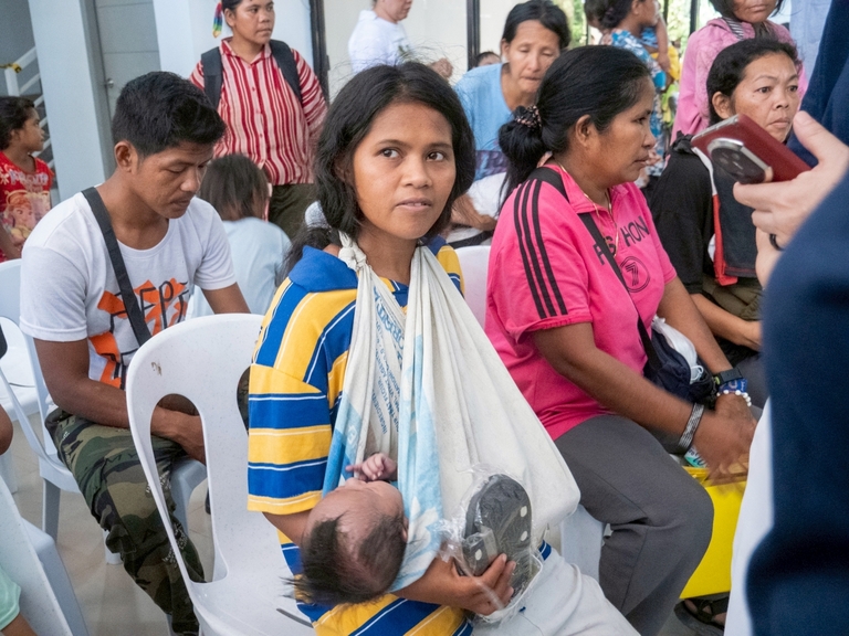 Slippers were distributed while patients waited for their medicines, bringing smiles to their faces.