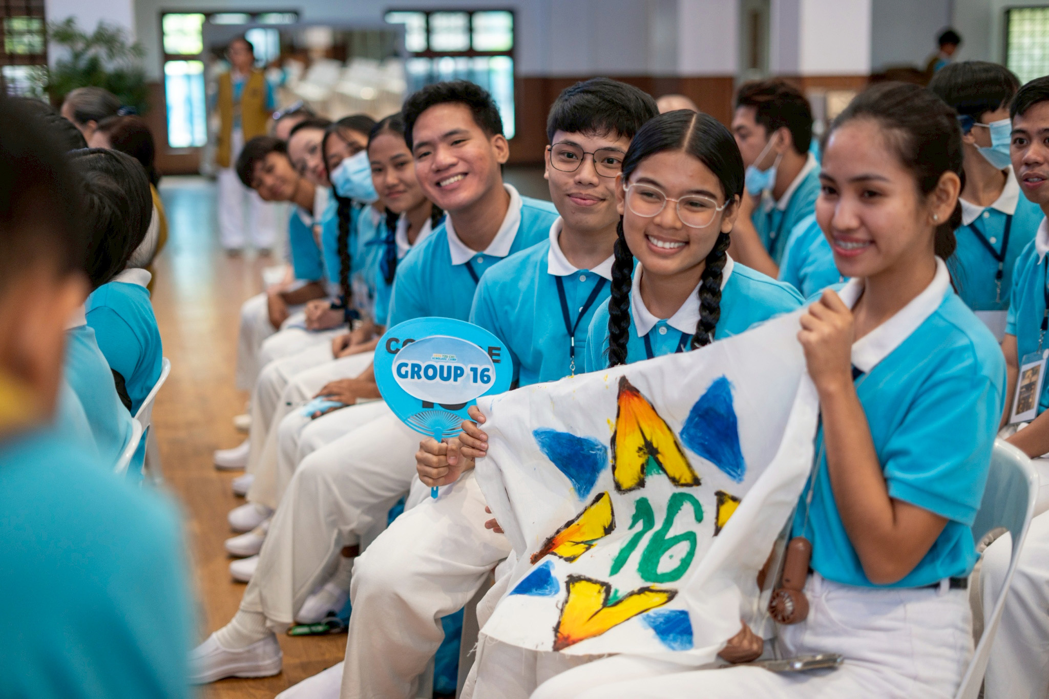 Scholars show off their banners, one of many great camp souvenirs. 