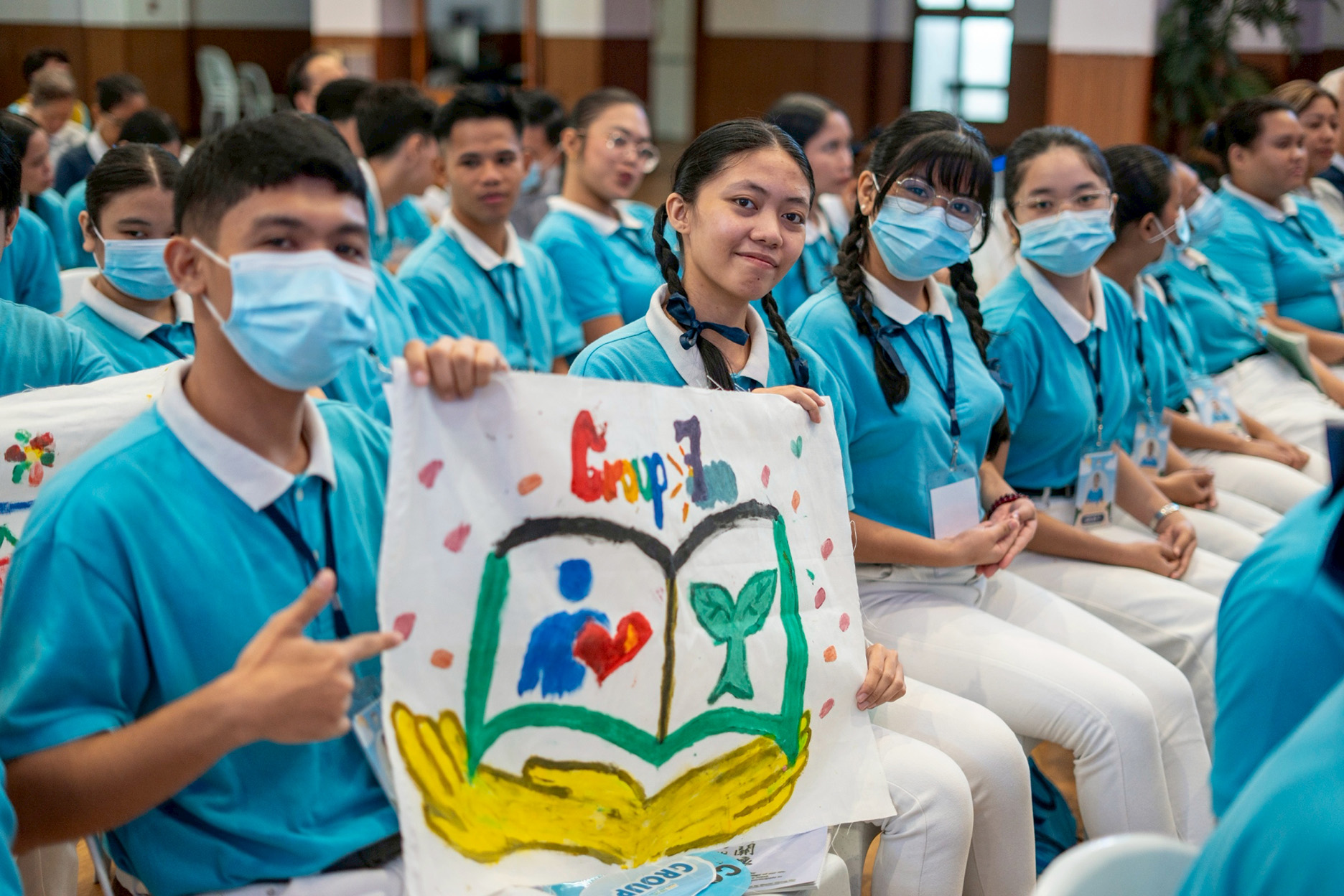 Scholars show off their banners, one of many great camp souvenirs. 