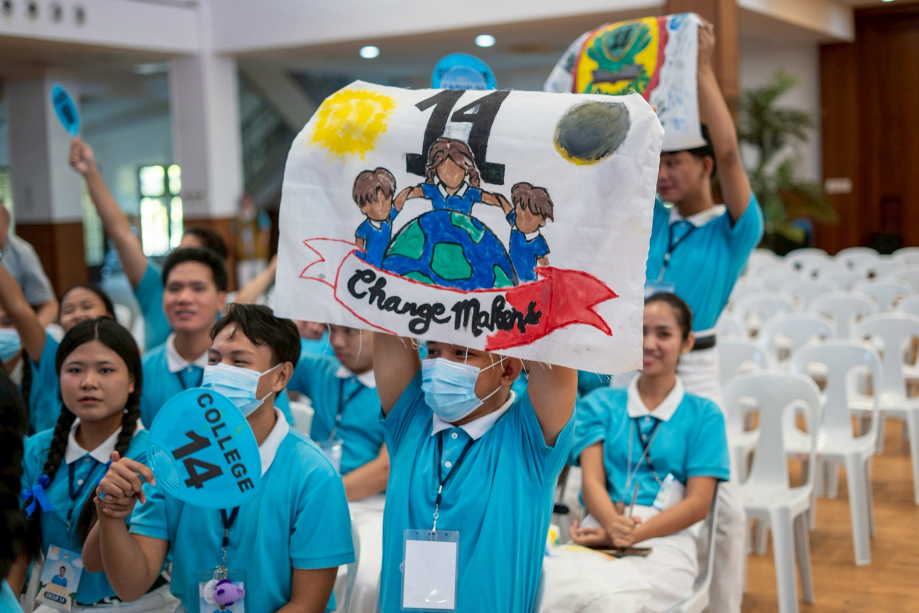 Scholars show off their banners, one of many great camp souvenirs. 