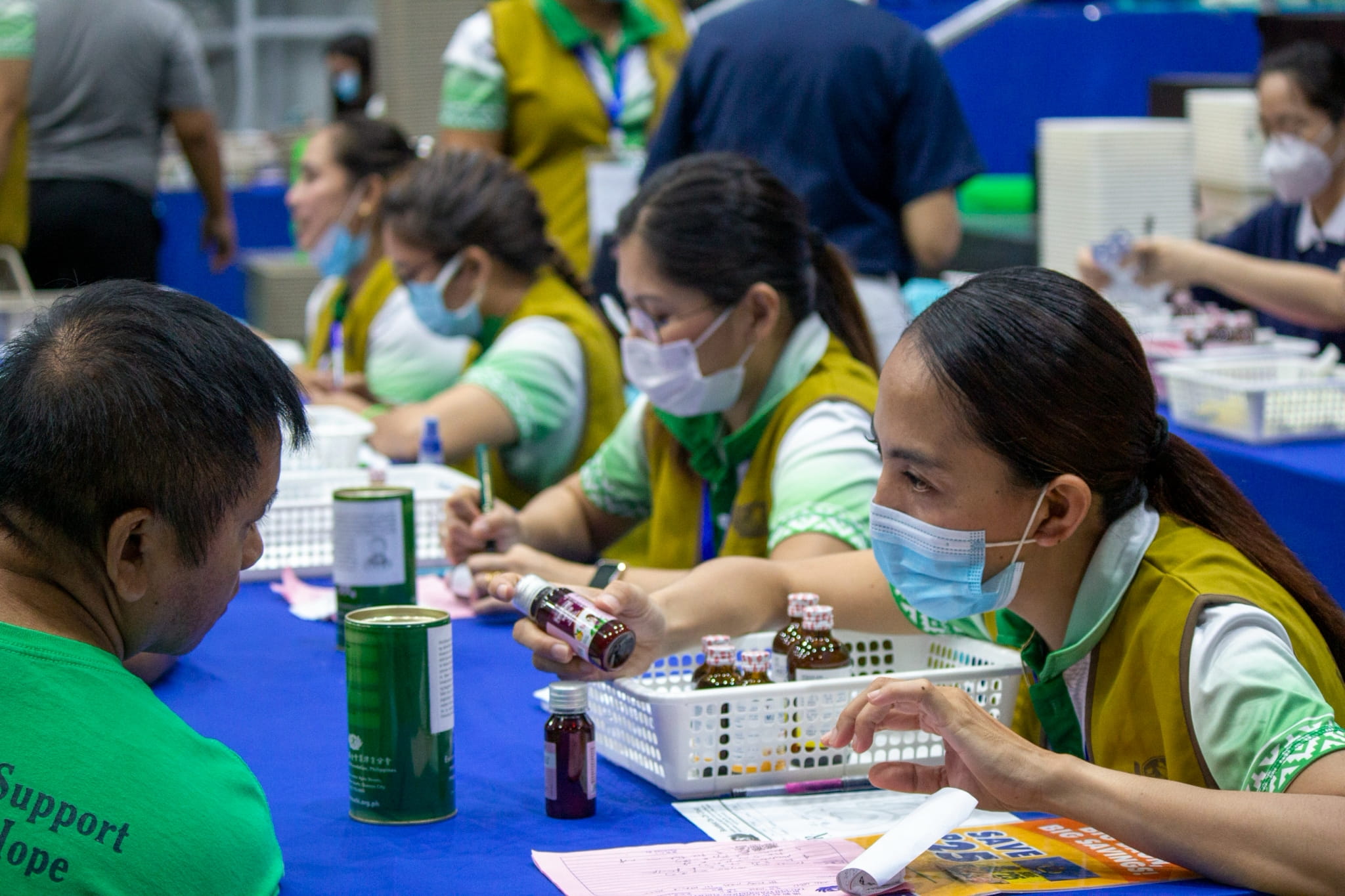 Patients with prescriptions receive free medicines after their medical consultations.