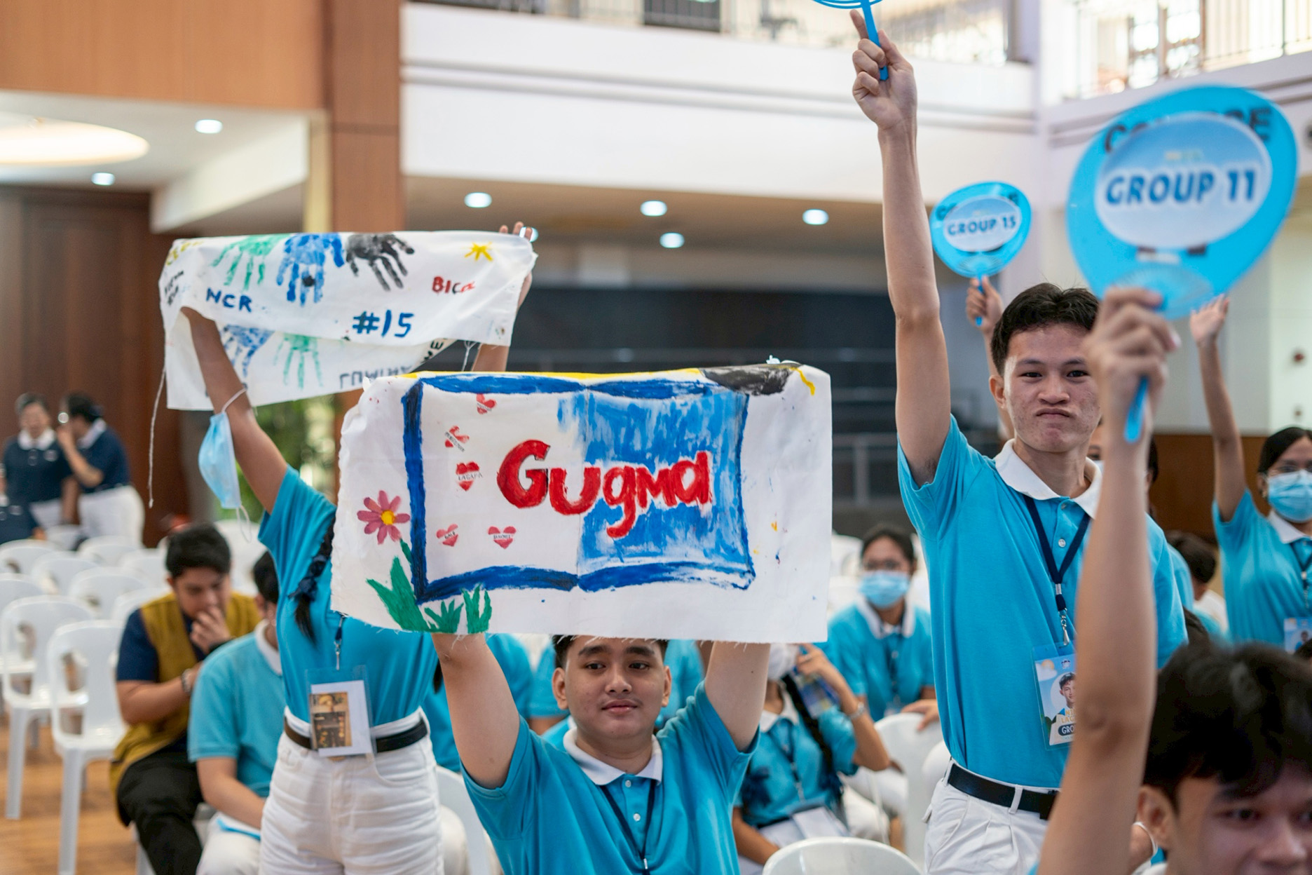 Scholars show off their banners, one of many great camp souvenirs. 