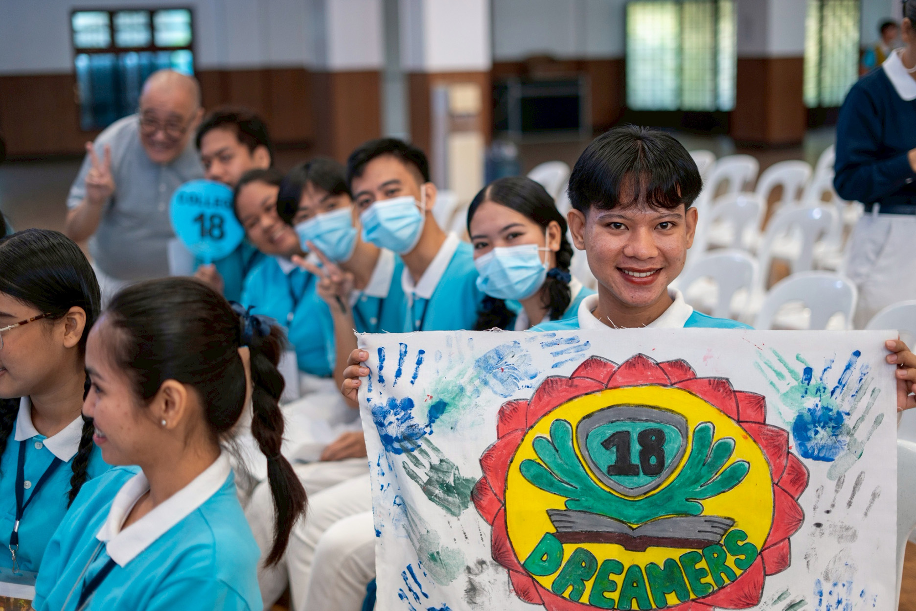 Scholars show off their banners, one of many great camp souvenirs. 