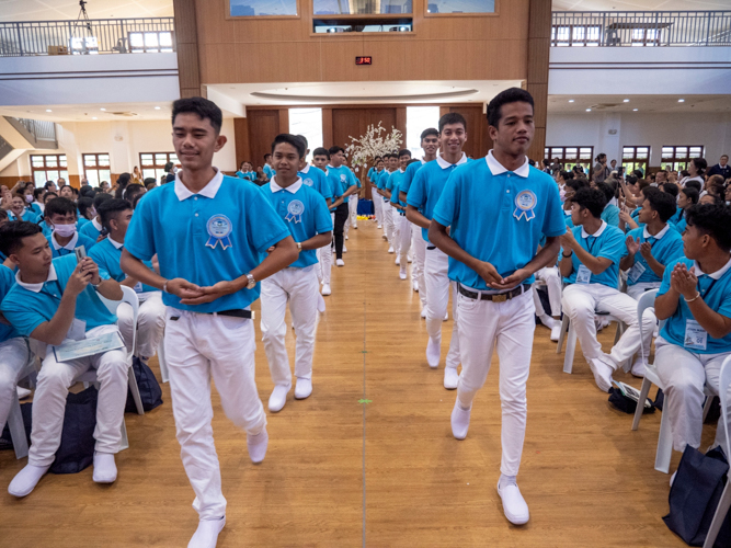 Graduating scholars enter the Jing Si Auditorium in disciplined fashion.