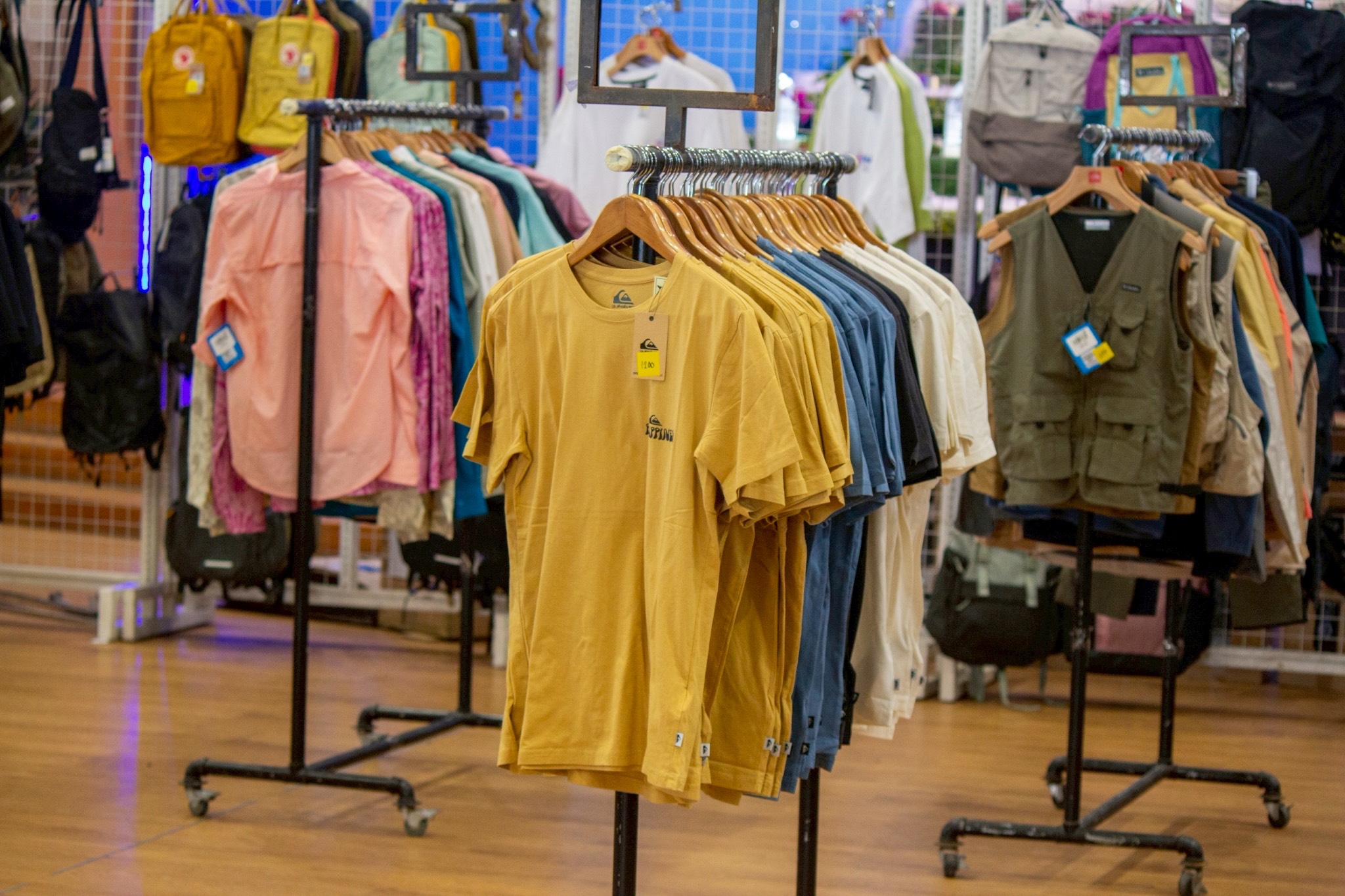 A wide selection of premium apparel is neatly displayed for shoppers.