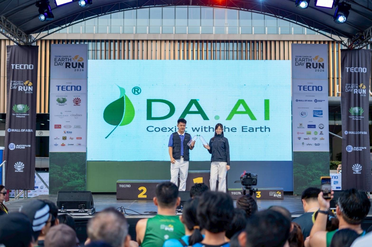 Tzu Chi Youth model clothing and accessories produced by DA.AI Technology. Founded in 2008 by volunteers and supporters of Tzu Chi, the social enterprise upcycles discarded PET bottles into durable textiles used to make bags, jackets, shirts, caps, and blankets. 