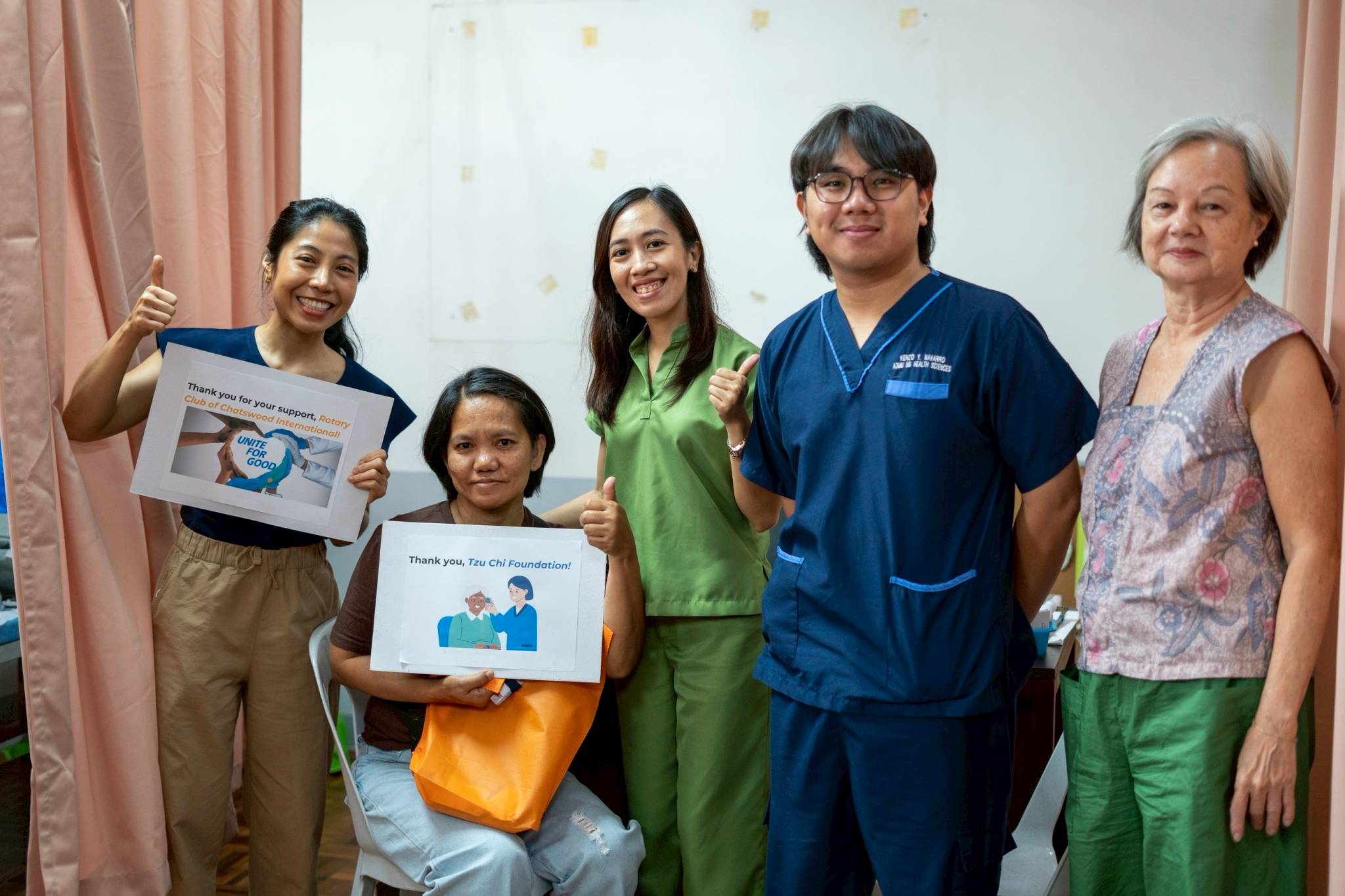 Together with the medical team and visiting refugee protection and displacement expert Rebecca Lim (first from right), Rhodora marks a moment of inclusion and accessible care.