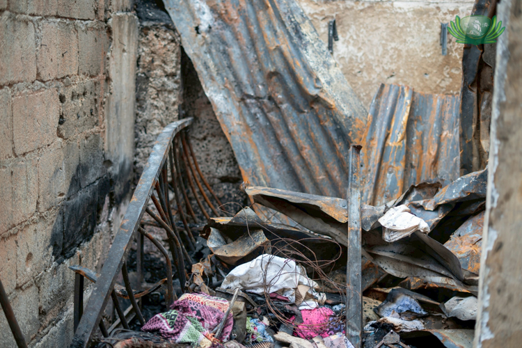 This three-story structure was the home of the Albino family. Now, the home has completely collapsed.