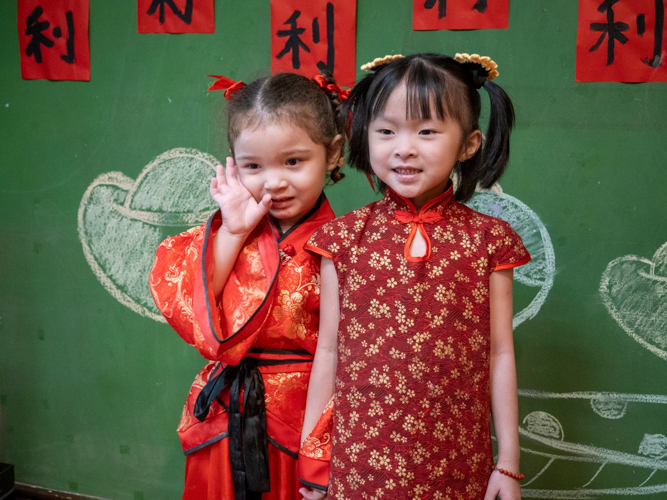 Preschoolers show up sporting their best Chinese attire. 