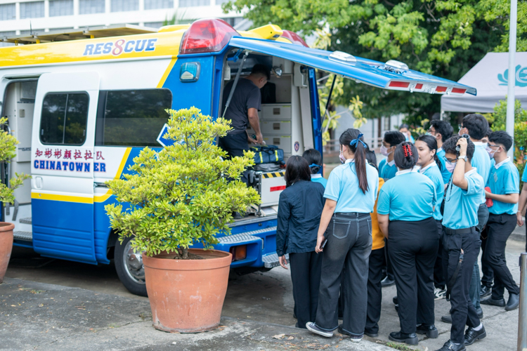 Scholars peer into Chinatown firemen’s ambulance, a fully equipped vehicle that could pass for a mini ER.