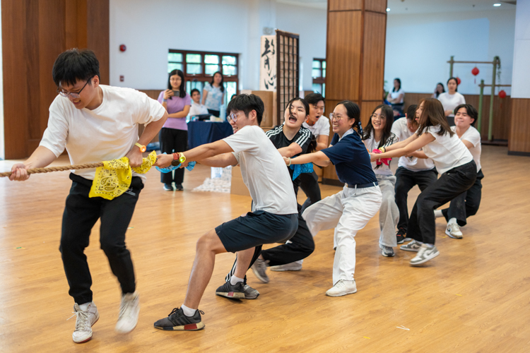 Teams put their collective strength to the test during an intense tug-of-war match.