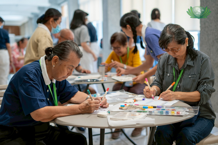 A bilateral brain gym exercise challenges seniors to draw patterns using their left and right hands.