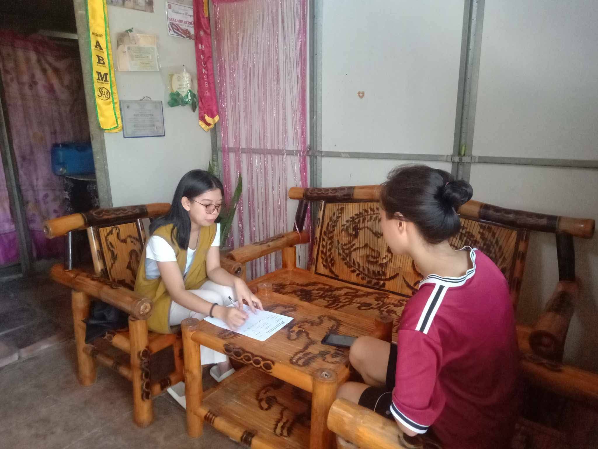 Sporting the Tzu Chi volunteer vest, Shekinah Salazar (left) participates in conducting home visitations.